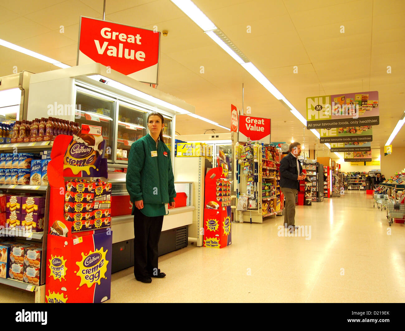 Inside a modern English supermarket in Weston super Mare, England, with Staff, Customers & stocked shelves. January 2013 Stock Photo