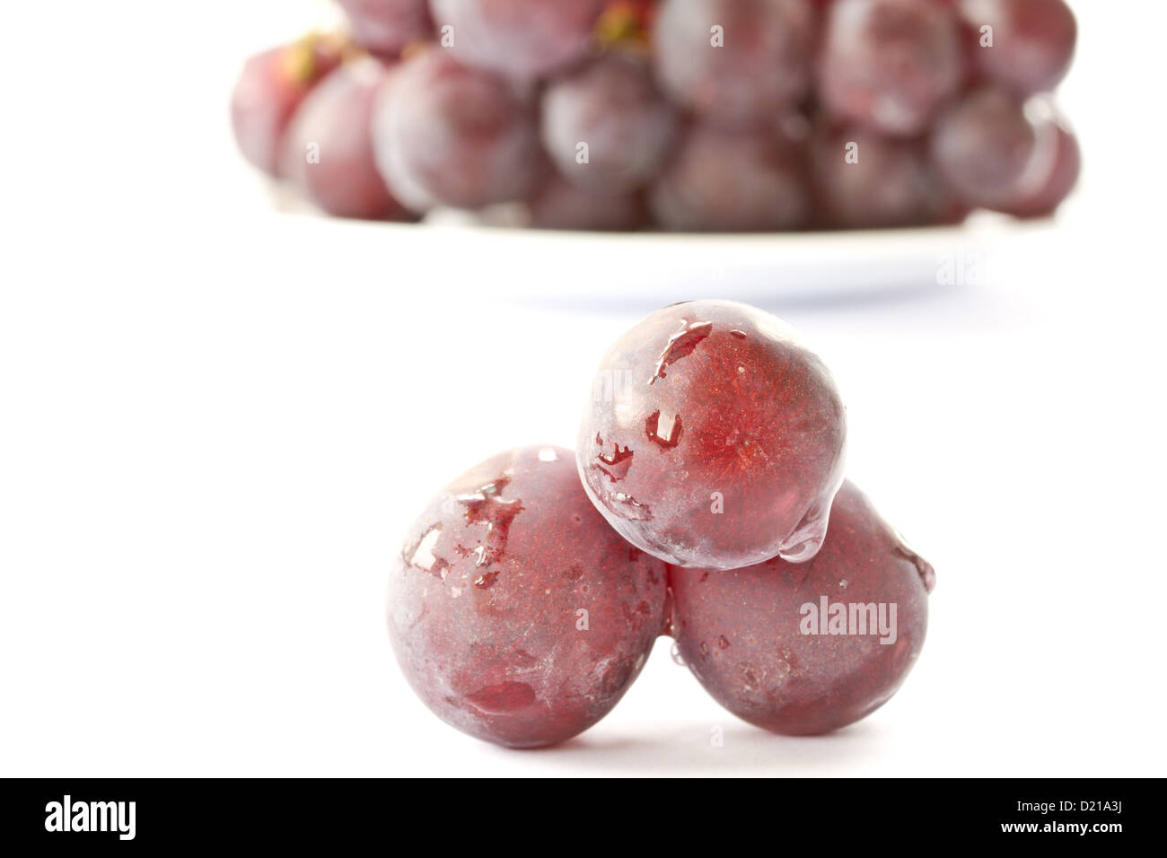 large bunch of grapes on a white background Stock Photo - Alamy