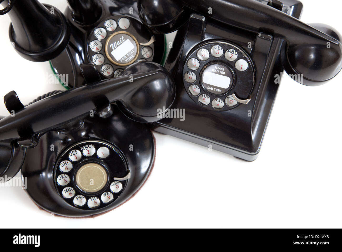 A group of vintage telephones on a white background Stock Photo