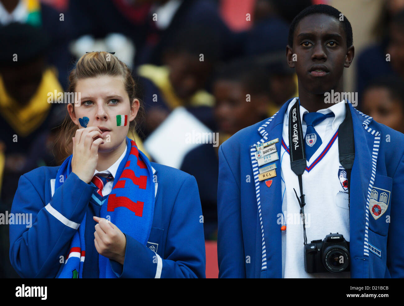 School uniformed spectators watch the action at the FIFA World Cup Group F match between Italy and Slovakia at Ellis Park. Stock Photo