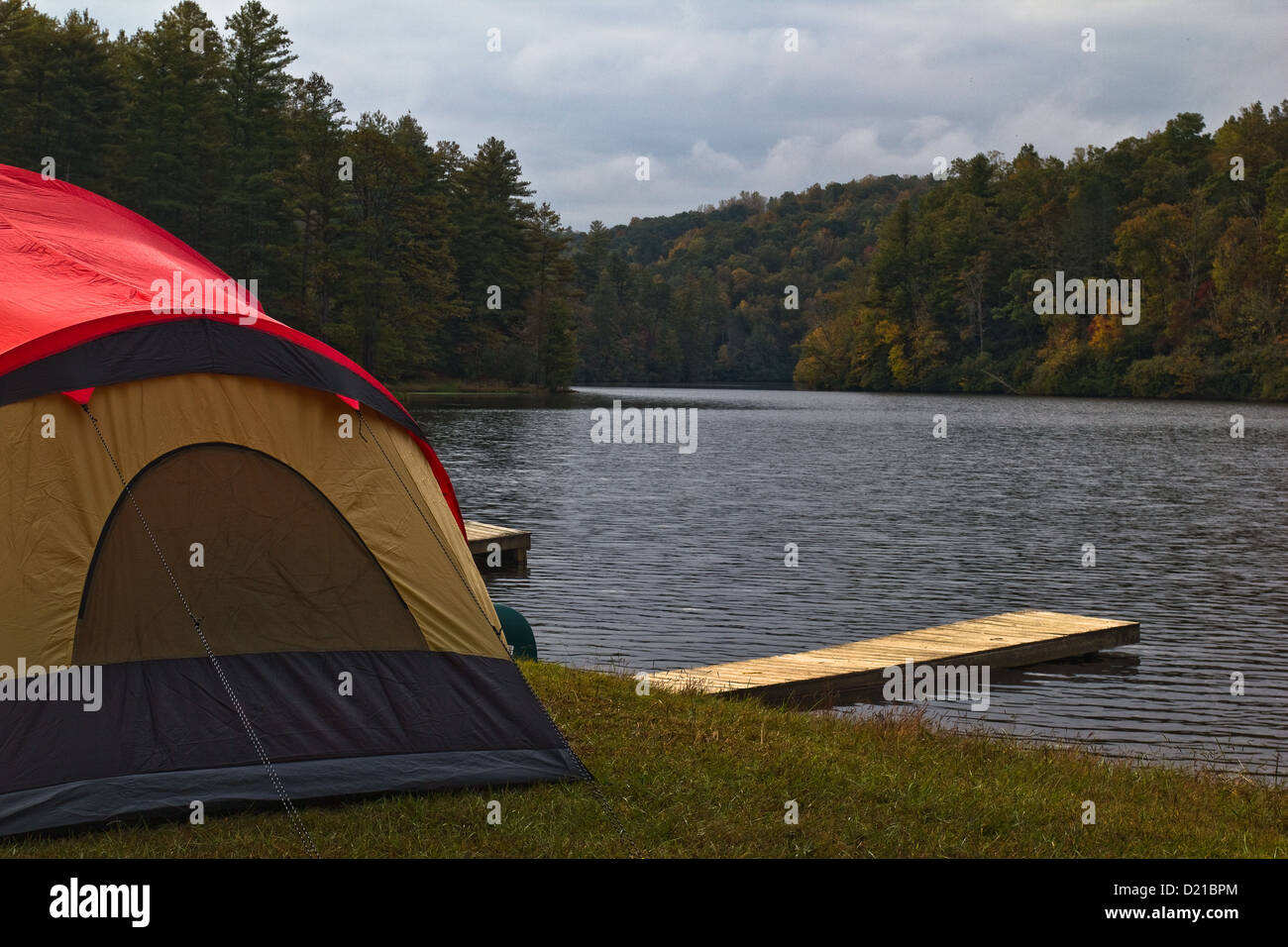 A tent camper set up by the waters of Cascade Lake near Brevard, NC USA Stock Photo