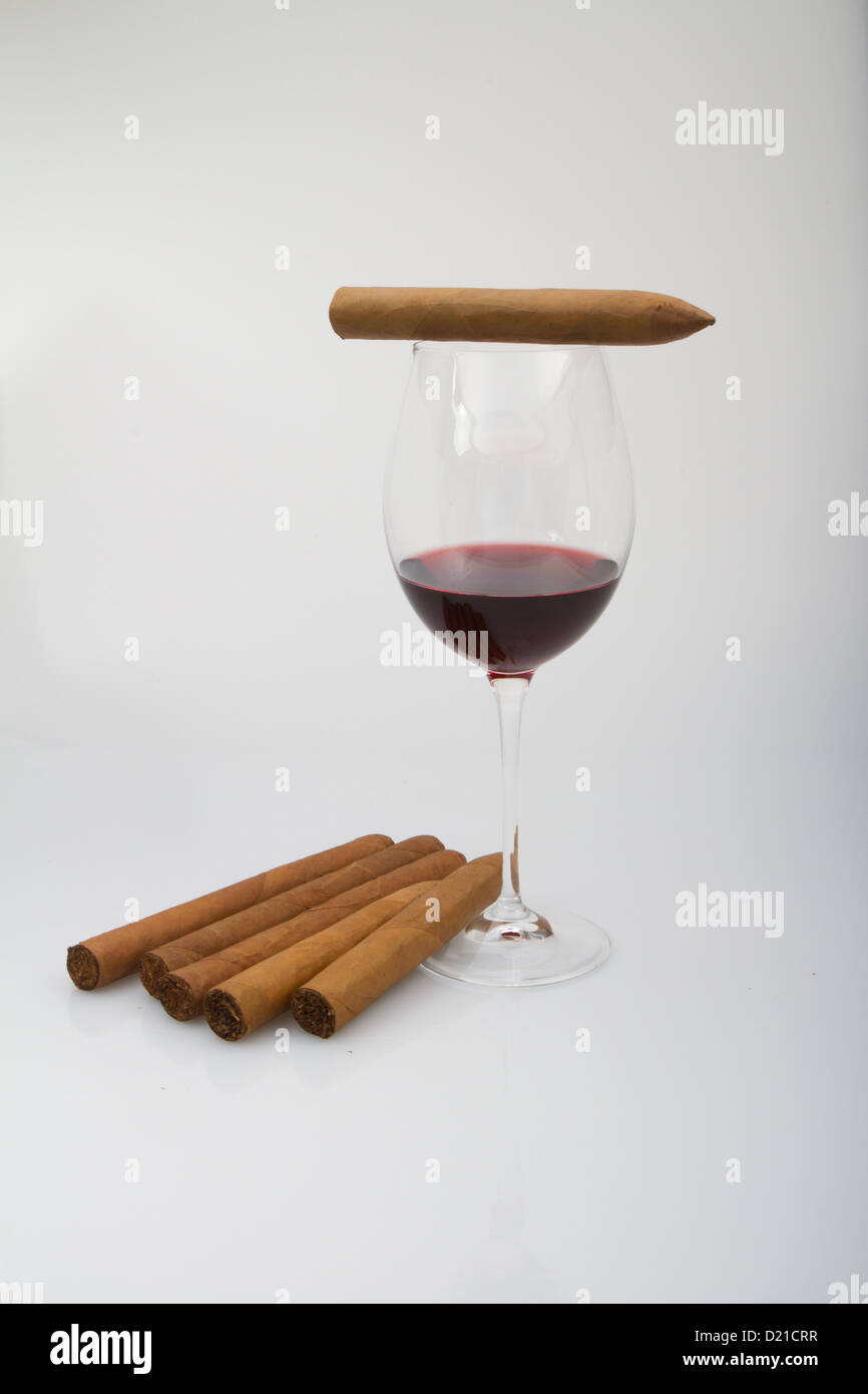 Red wine glass with cigars Stock Photo Alamy