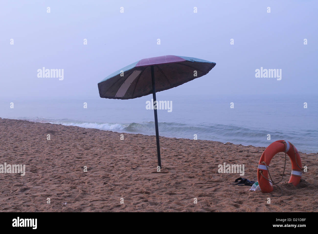 Beach Umbrella and lifebuoy Stock Photo