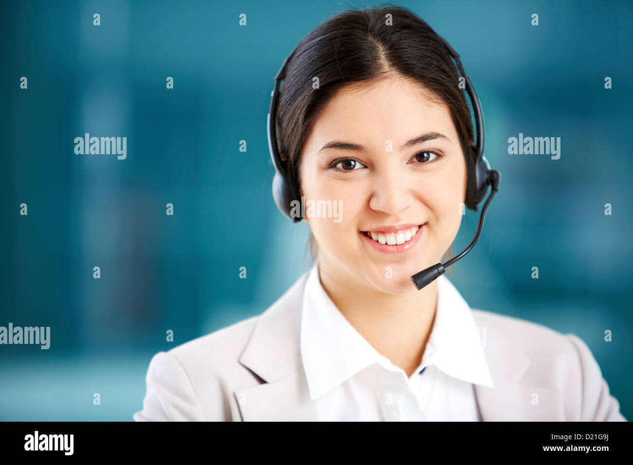 Portrait of a young customer support representative consulting the ...
