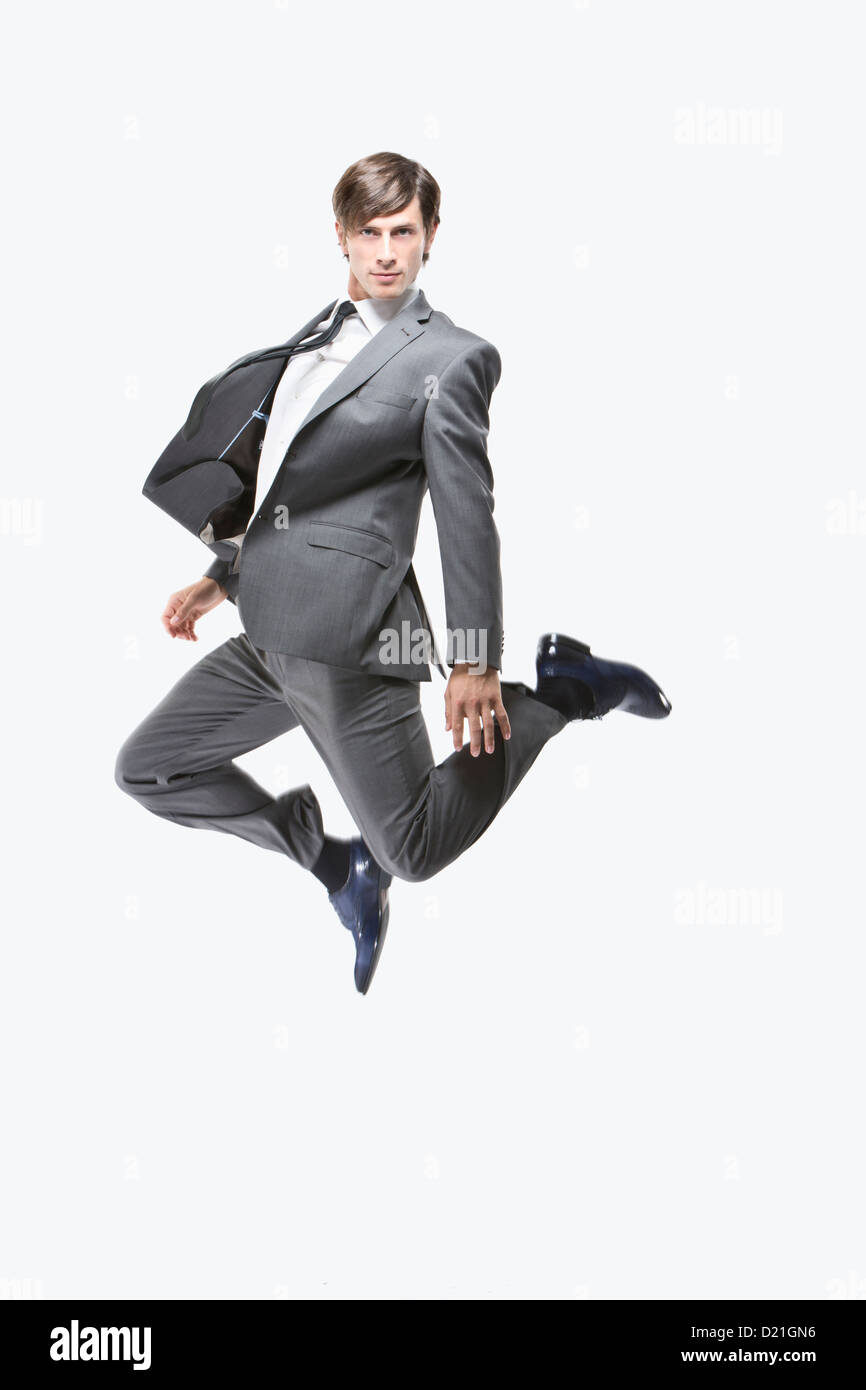 Businessman jumping, portrait Stock Photo