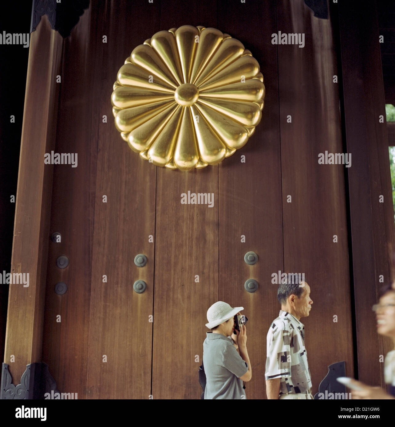 Visitors enter through the main gate at the Yasukuni Shrine in Tokyo, Japan Stock Photo