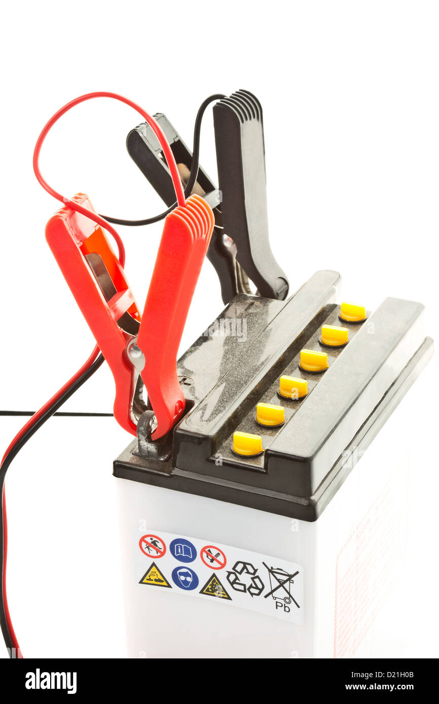 Car battery with charger on white background Stock Photo Alamy