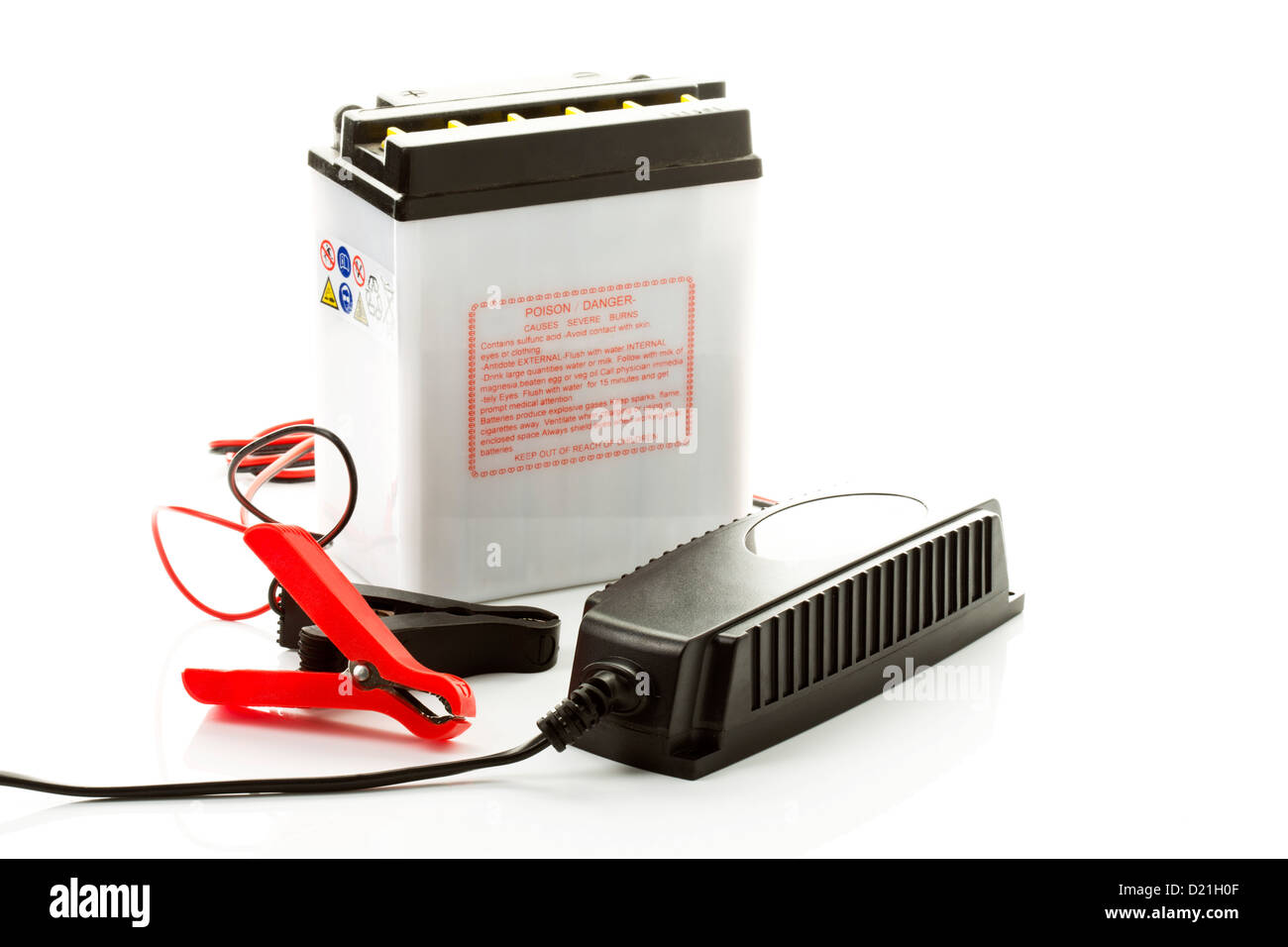 Car battery with charger on white background Stock Photo Alamy