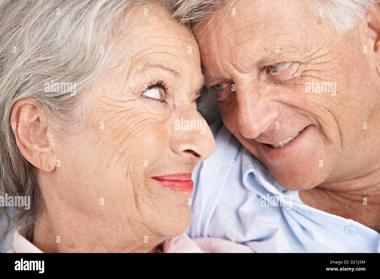 Spain, Senior couple looking at each other, smiling Stock Photo - Alamy