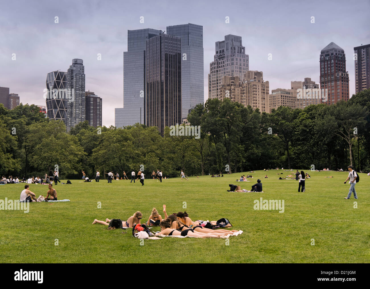 Group of girls sunbathing in Central Park, Manhattan, New York, USA ...