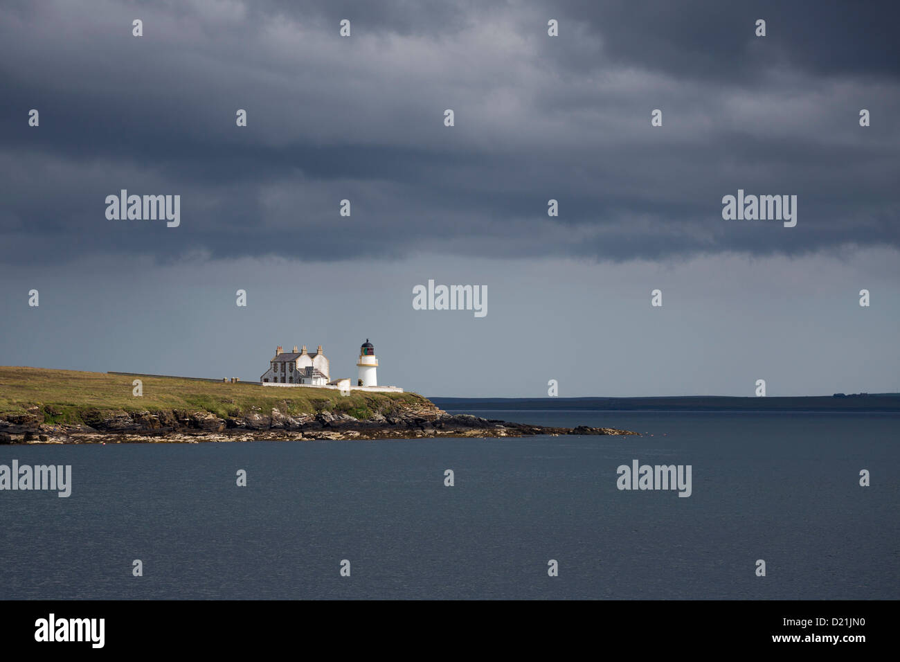 Lighthouse of the Graad and storm clouds, Egilsay Island, Orkney Islands, Scotland, United Kingdom Stock Photo