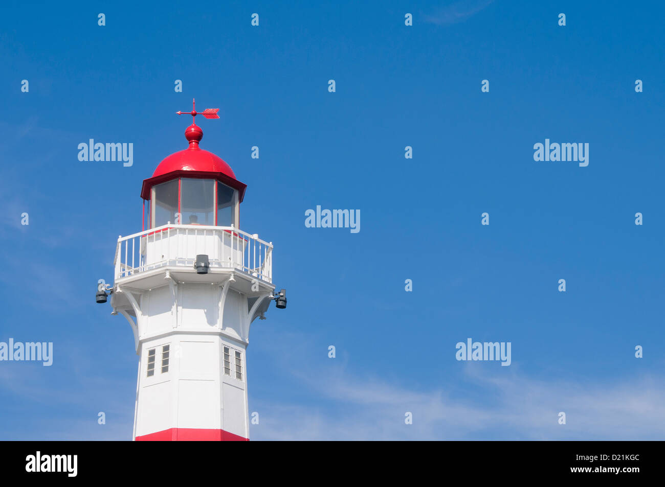 A red and white lighthouse in the harbor of Malmo, Sweden Stock Photo