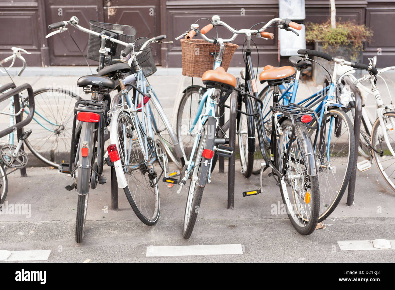 Paris, France: Old bicycles parked haphazardly on the street Stock Photo