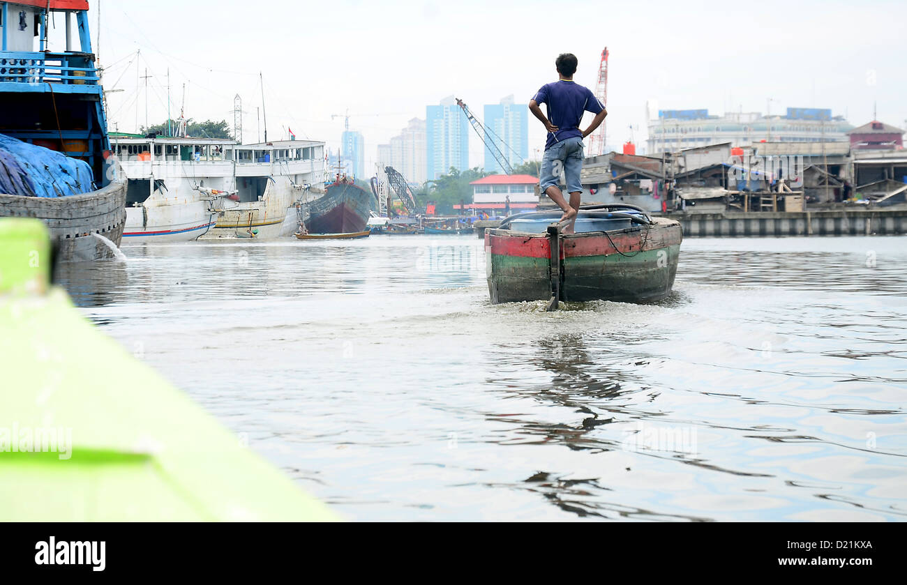 Conceptual Human interest potrait of Fisherman standing in his boat(02)