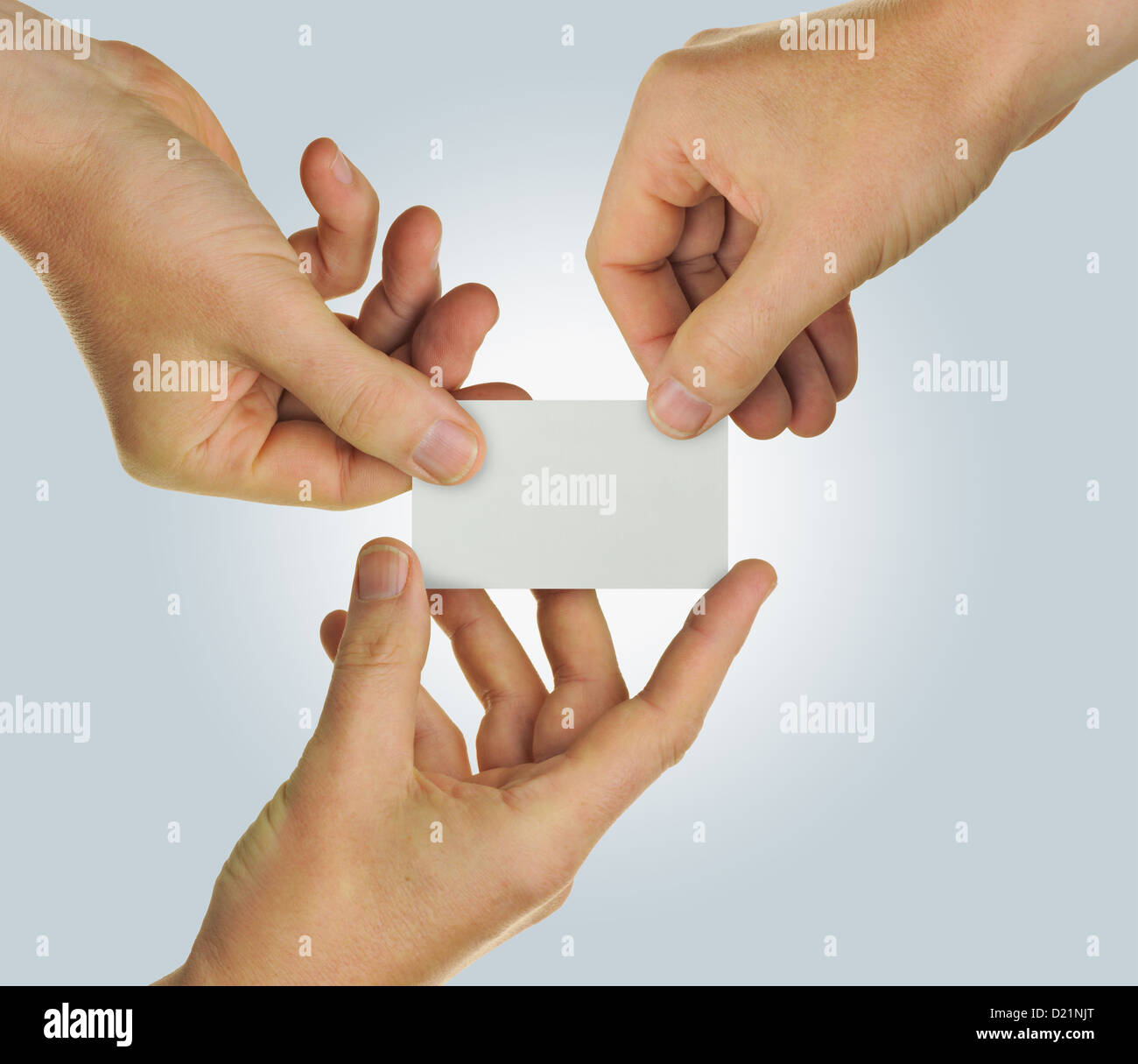 Hands holding a blank business card representing teamwork Stock Photo