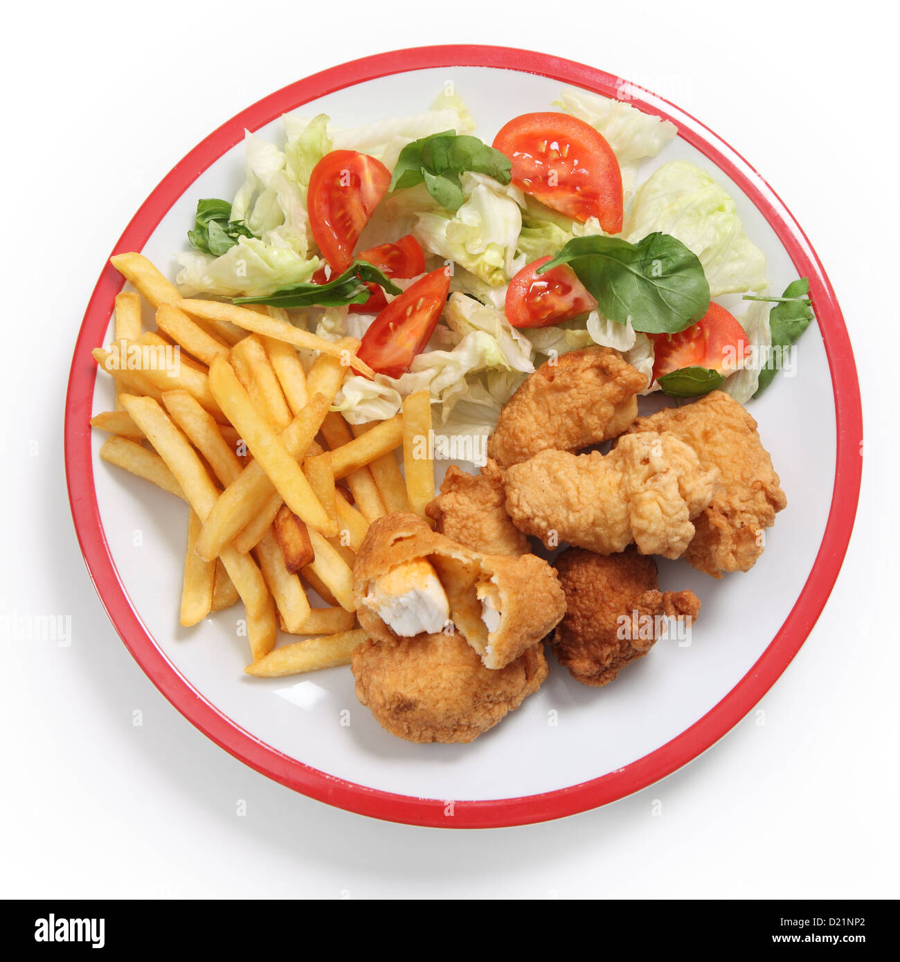 A meal of homemade kingfish nuggets served with french fried potato chips and a salad of tomato, lettuce and rocket. Stock Photo