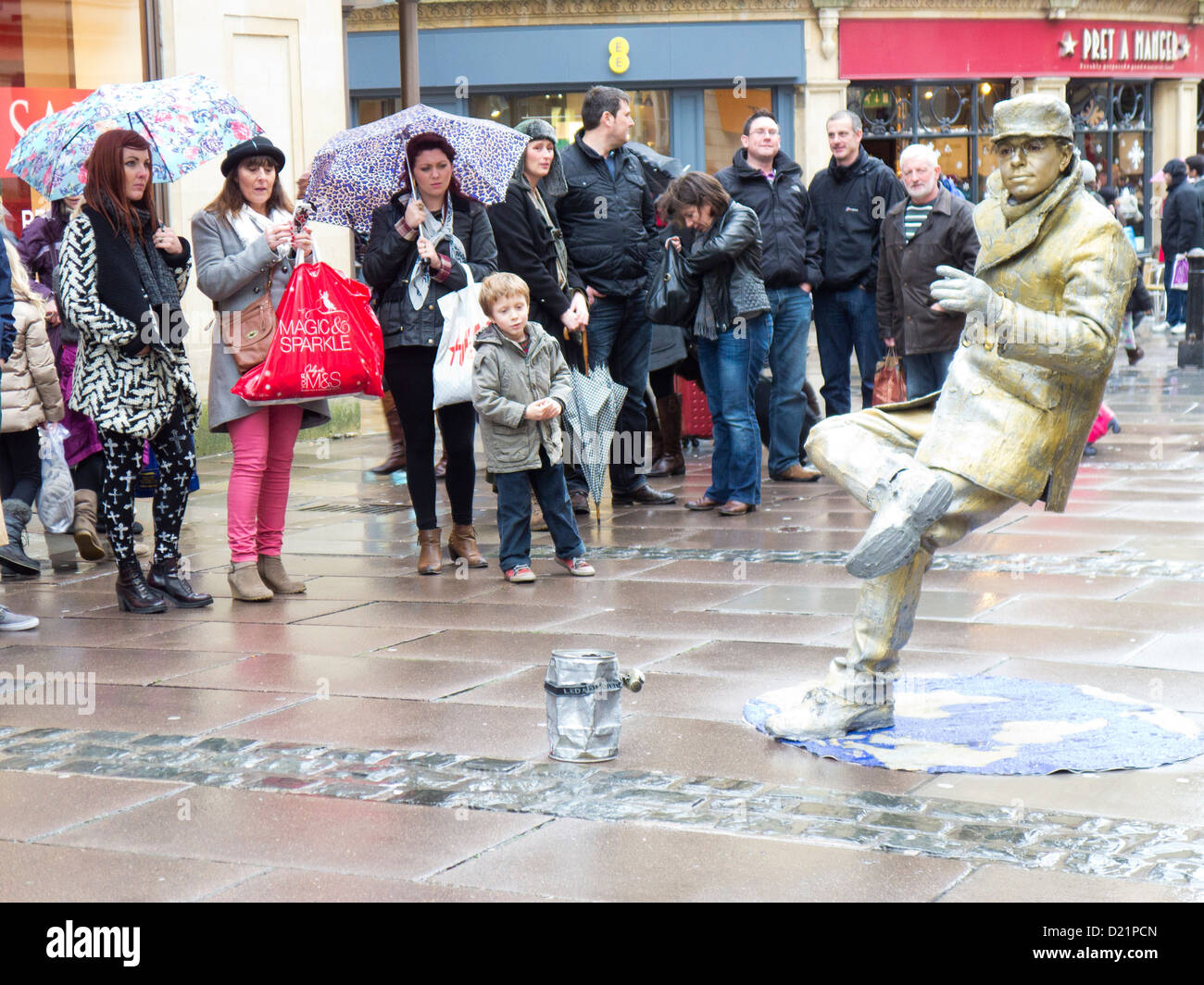 Busker balancing illusion. Bath England Stock Photo