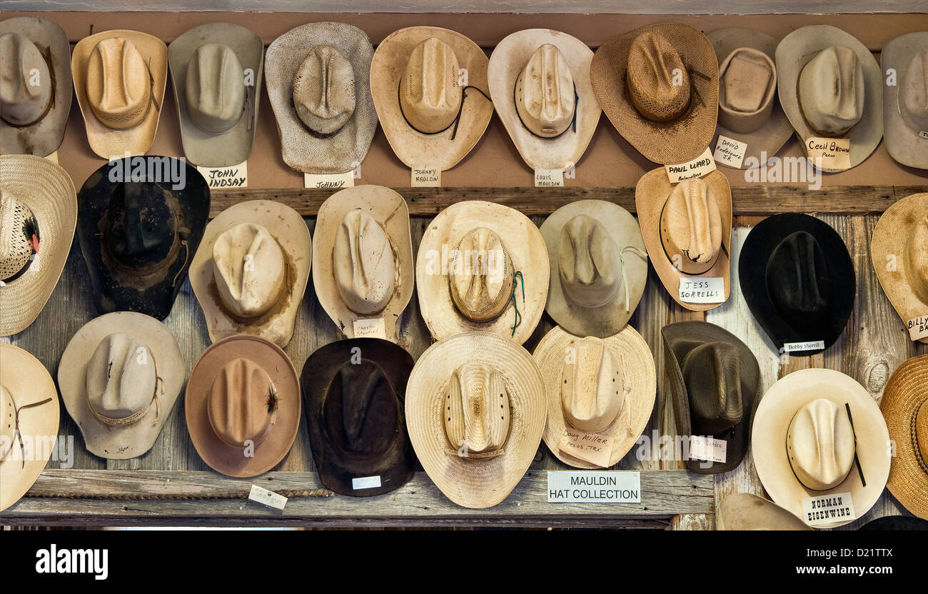 Cowboy hats identified with owners names at Rodeo and Brand Room at West of the Pecos Museum in Pecos, Texas, USA Stock Photo