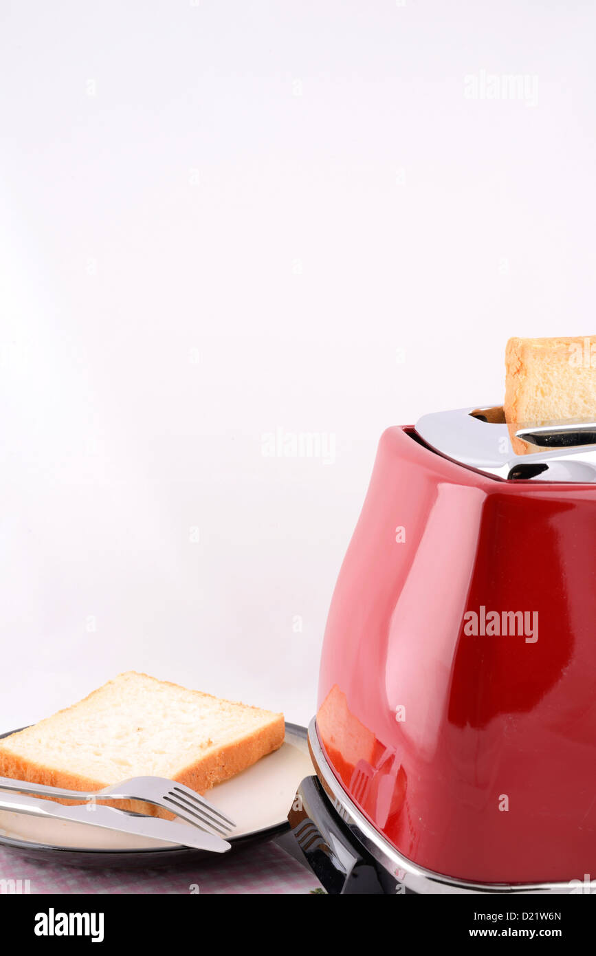 Morning breakfast photo of bread and toaster with white seamless background. Stock Photo