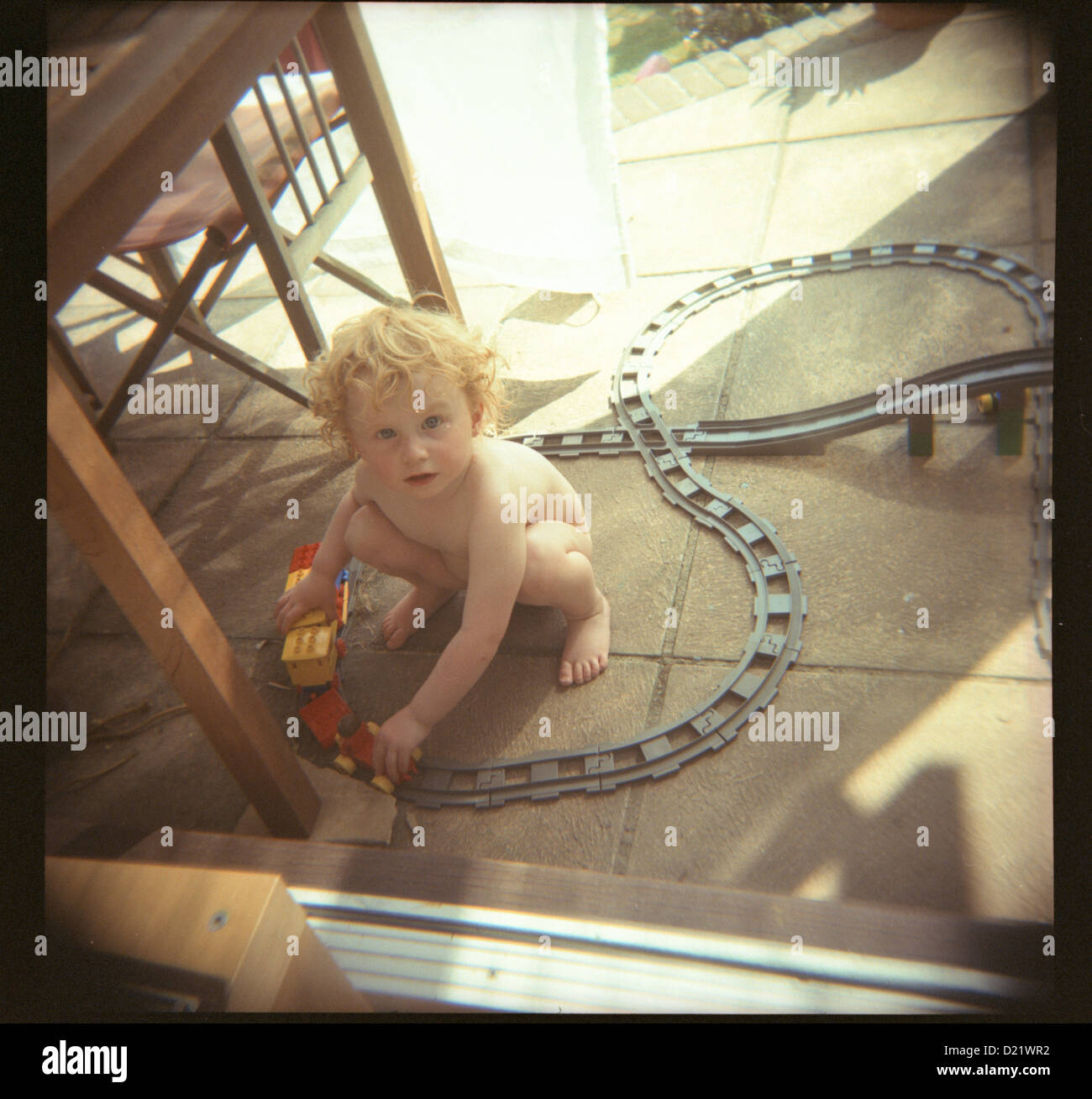 Boy playing with train set stock photo alamy