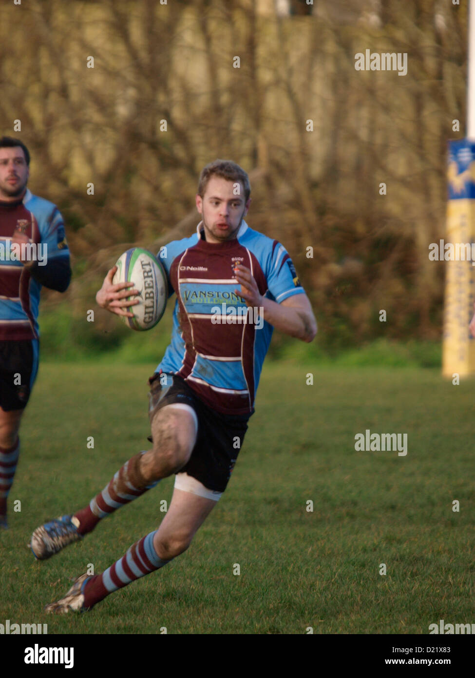 Steping Rugby Rugby player side stepping, Bude, Cornwall, UK Stock Photo - Alamy