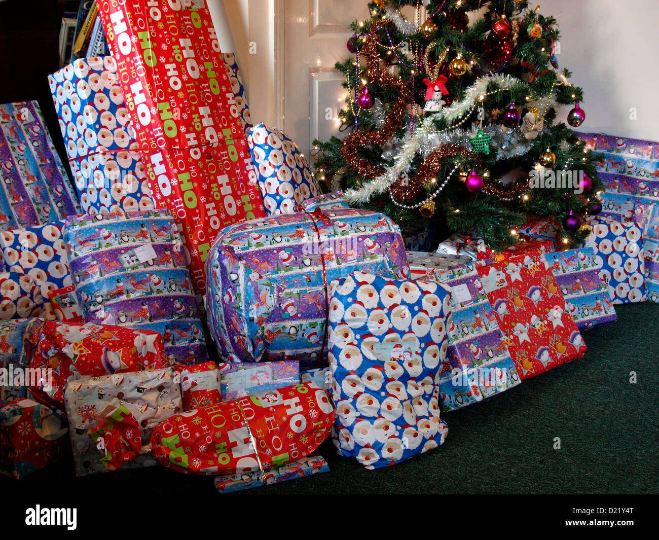 Presents around a Christmas tree, UK Stock Photo Alamy