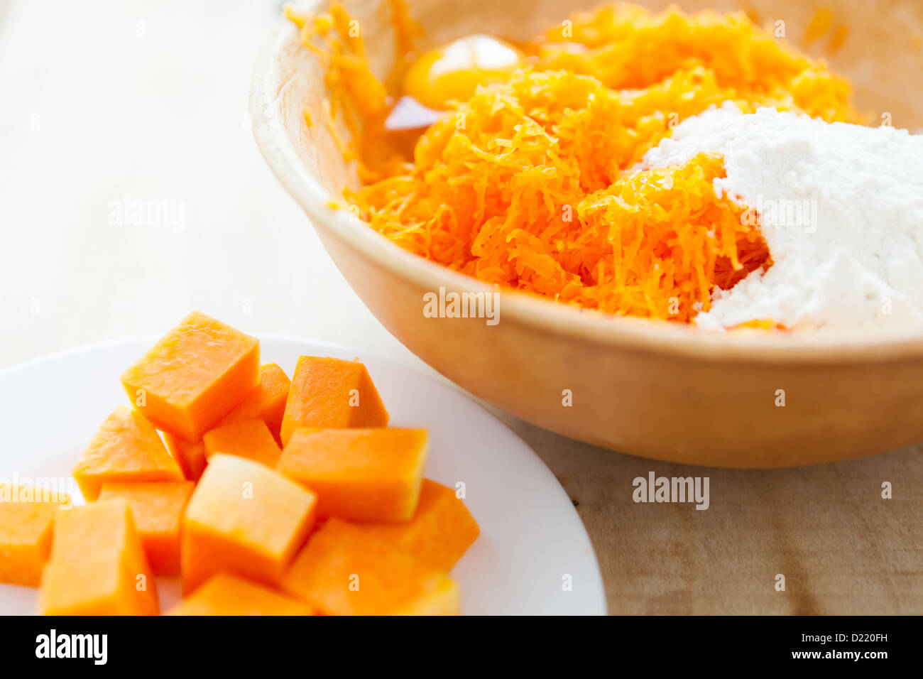raw pumpkin the pieces and grated in a bowl, food Stock Photo Alamy