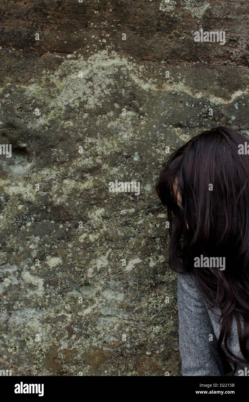 Sad Woman Leaning Against The Wall Outdoors Stock Photo Alamy