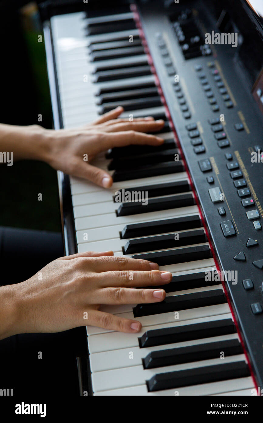 Hands playing electric keyboard Stock Photo Alamy
