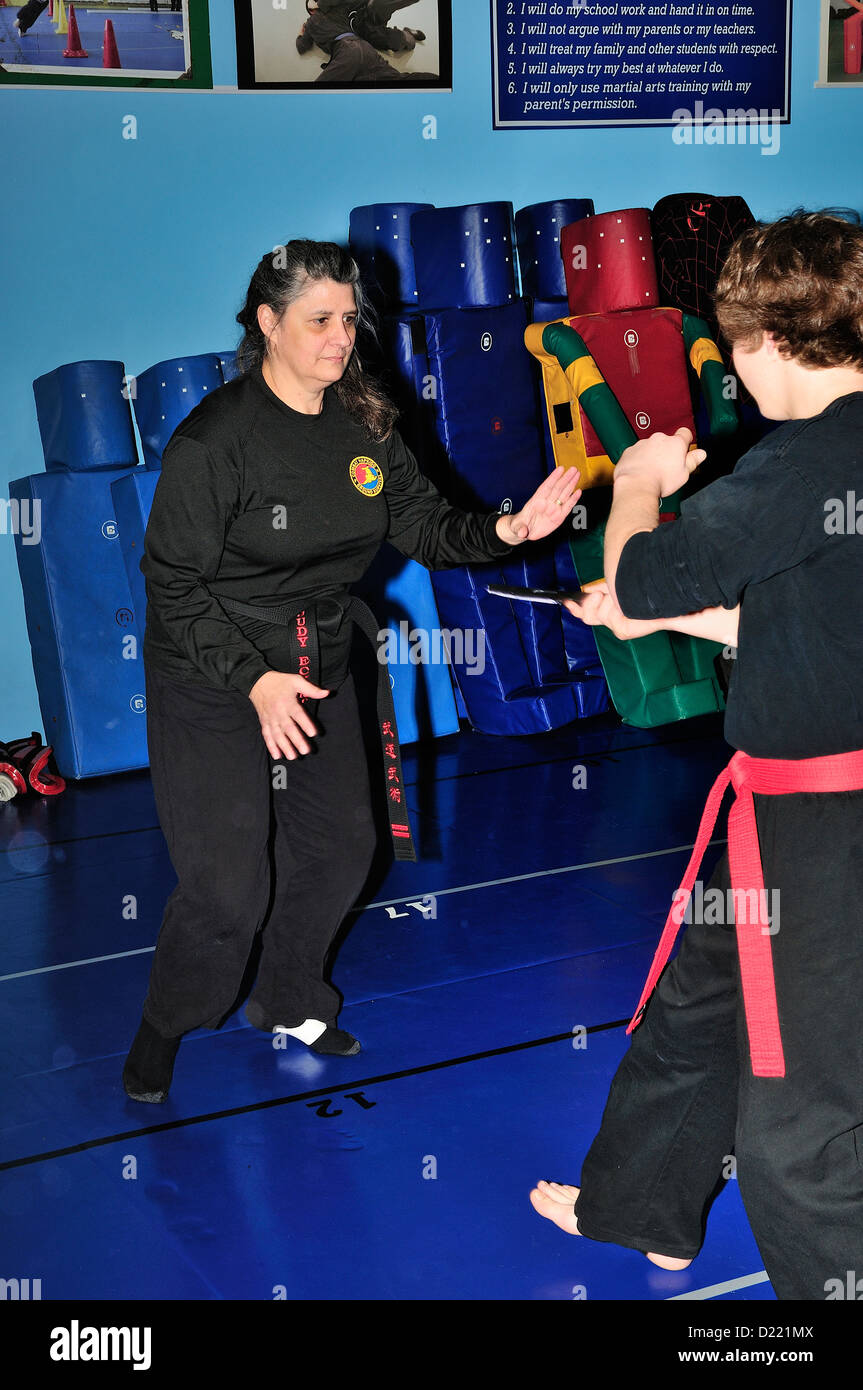 Hapkido Black Belt and Red Belt combatants practicing their art at a