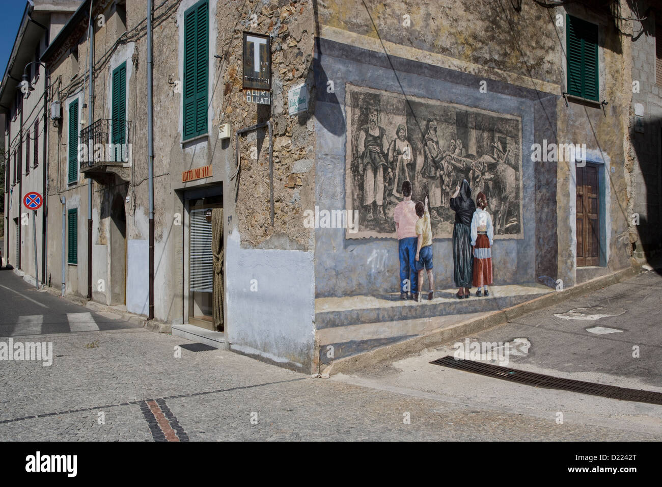 Sardinia: Fonni - trompe l'oeil on a building in the village centre Stock Photo