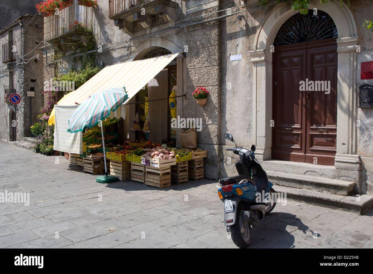 Novara di Sicilia: local fruit & veg shop with sunshade awnings Stock Photo