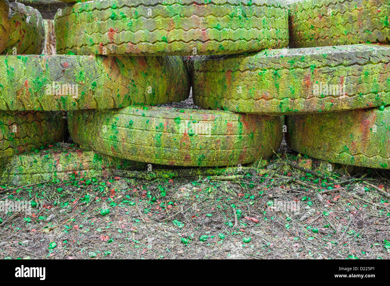 Paint covered barricade made of tires on paintball field, Oregon Stock