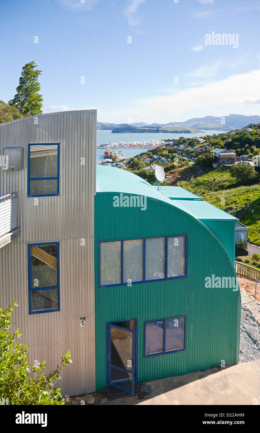 A quirky style corrugated metal house overlooking Lyttleton harbour. Christchurch, Canterbury, South Island, New Zealand. Stock Photo