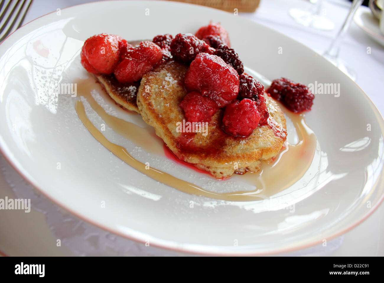 Berry pancakes on a white plate at M on the Bund restaurant, Shanghai, China Stock Photo