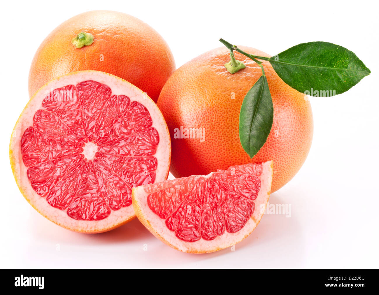 Grapefruit with slices on a white background. Stock Photo