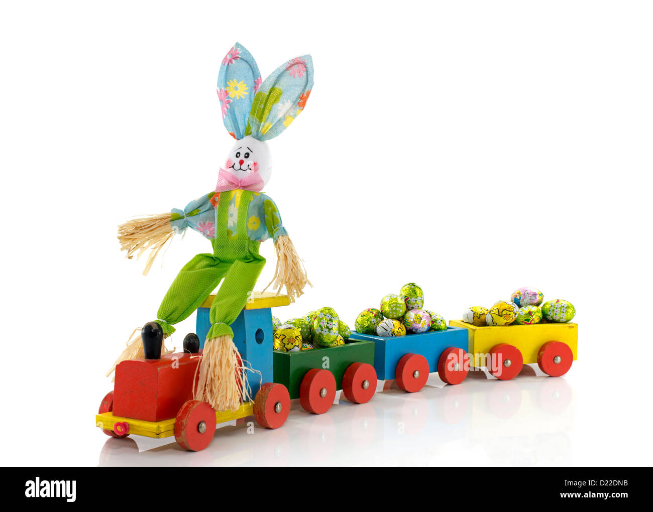 easter bunny with wooden train and easter eggs Stock Photo