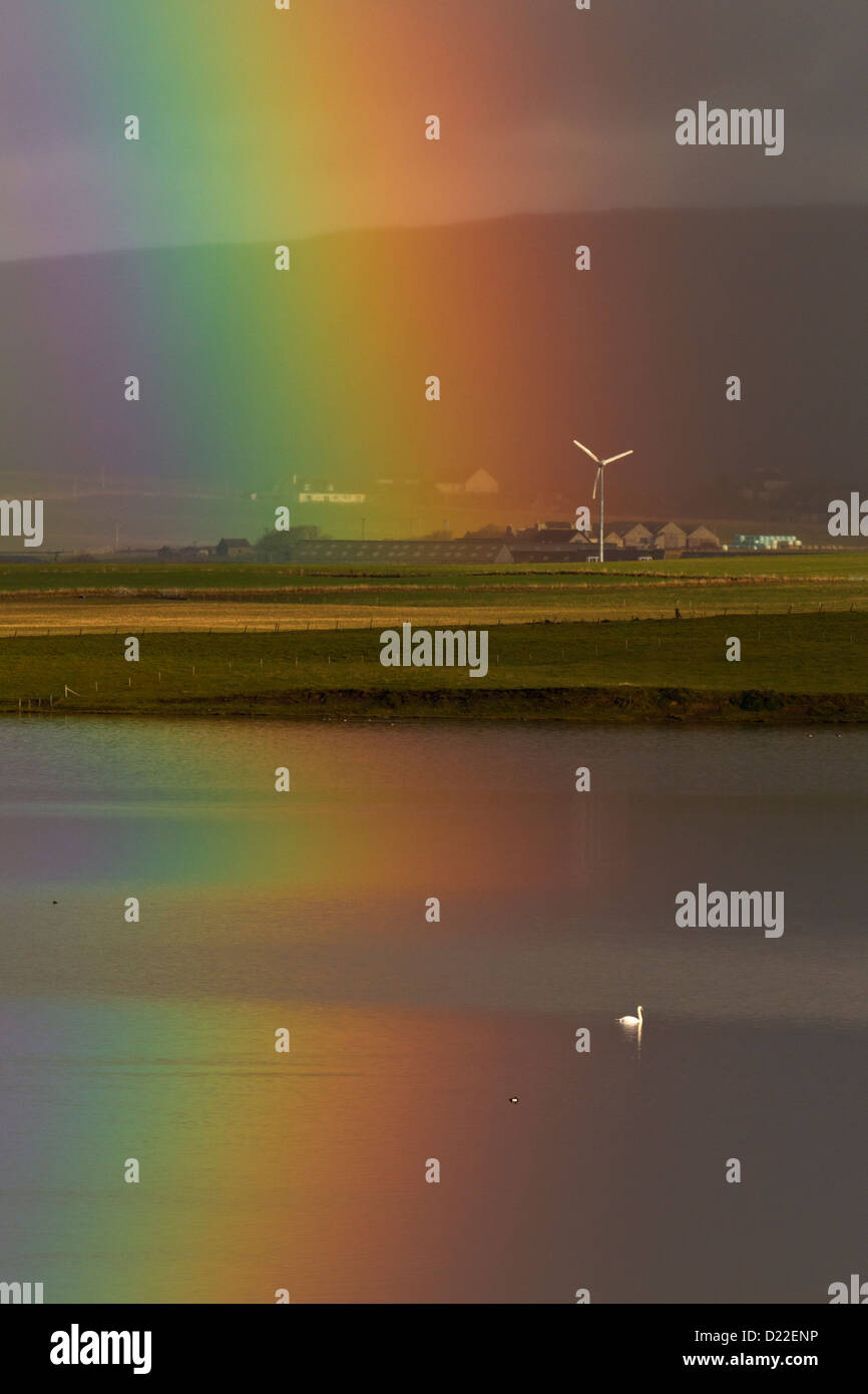 Rainbow with wind turbine, Orkney isles Stock Photo