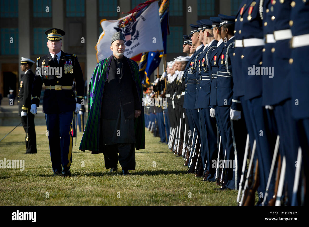 120110-D-TT977-048U.S. Army Col. James Markert escorts Afghanistan's President Hamid Karzai as he inspects the troops in formation on the Pentagon River Parade Field on Jan. 10, 2013.  Secretary of Defense Leon E. Panetta is hosting the full honors arrival ceremony to welcome Karzai to the Pentagon.  Panetta, Karzai and their senior advisors will meet to discuss national security items of interest to both nations.  DoD photo by Petty Officer 1st Class Chad J. McNeeley, U.S. Navy.  (Released) Stock Photo