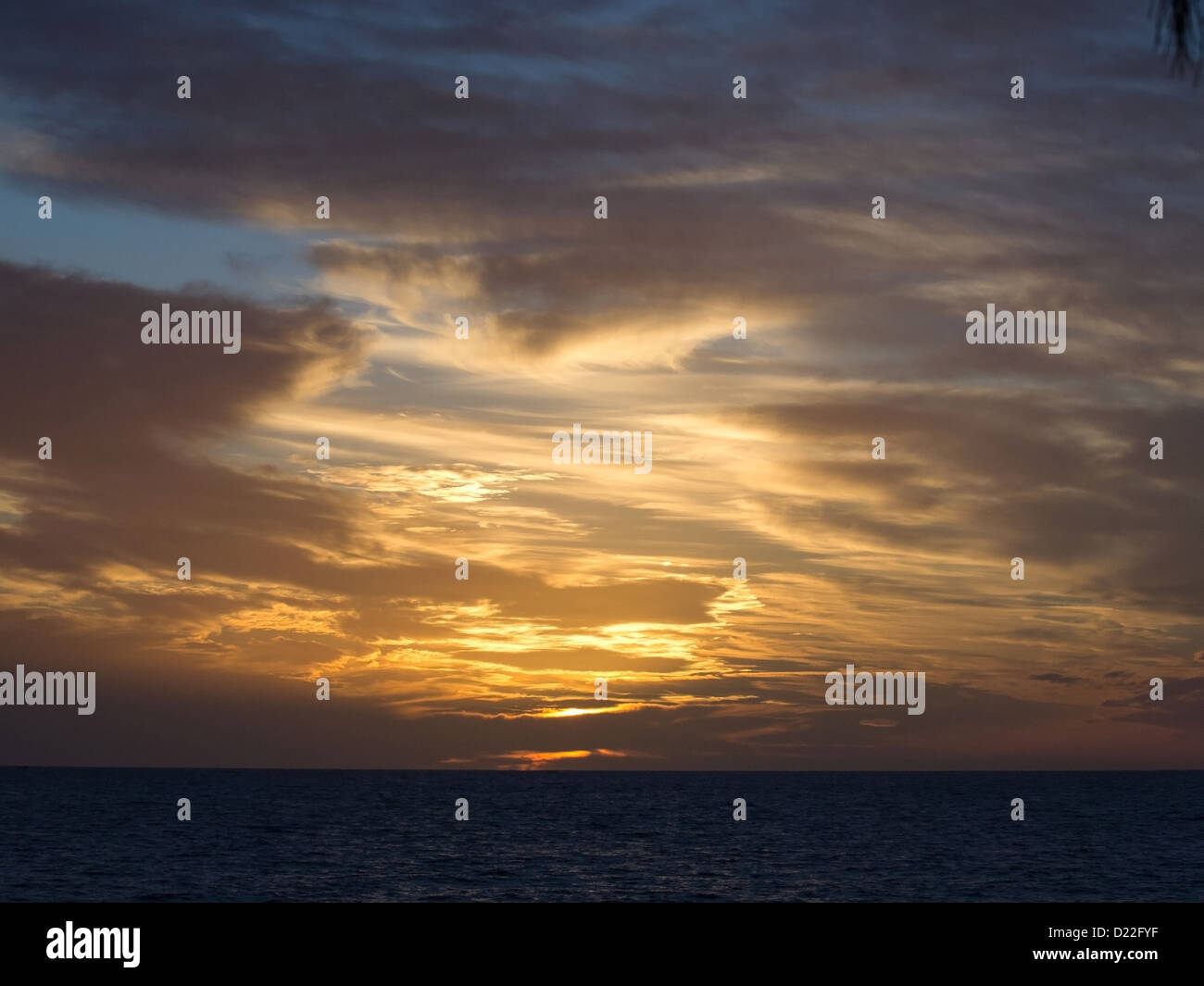 orange and blue sky sunset over the sea Stock Photo