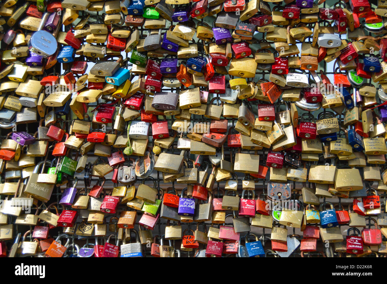 Locks of love – padlocks chained to the railings of the Köln railway bridge Stock Photo