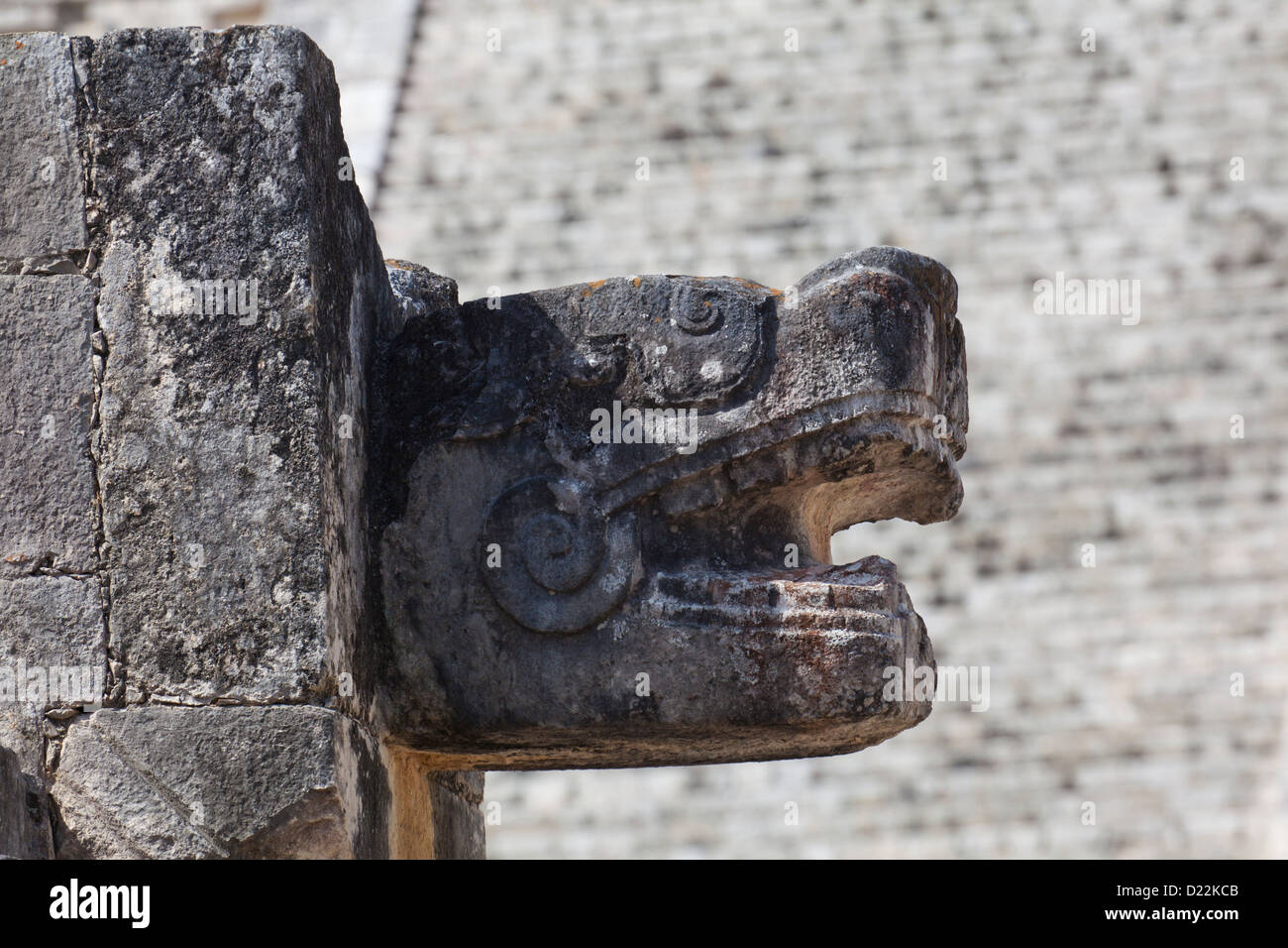 Stone carved head on the Platform of the Eagles and Jaguars at Chichen Itza, Yucatan, Mexico Stock Photo