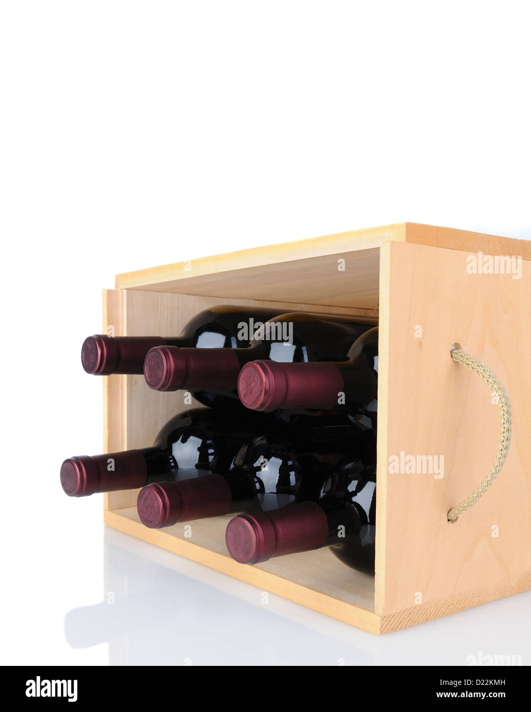 Closeup of six Cabernet Sauvignon wine bottles in a wooden crate laying on its side. Stock Photo