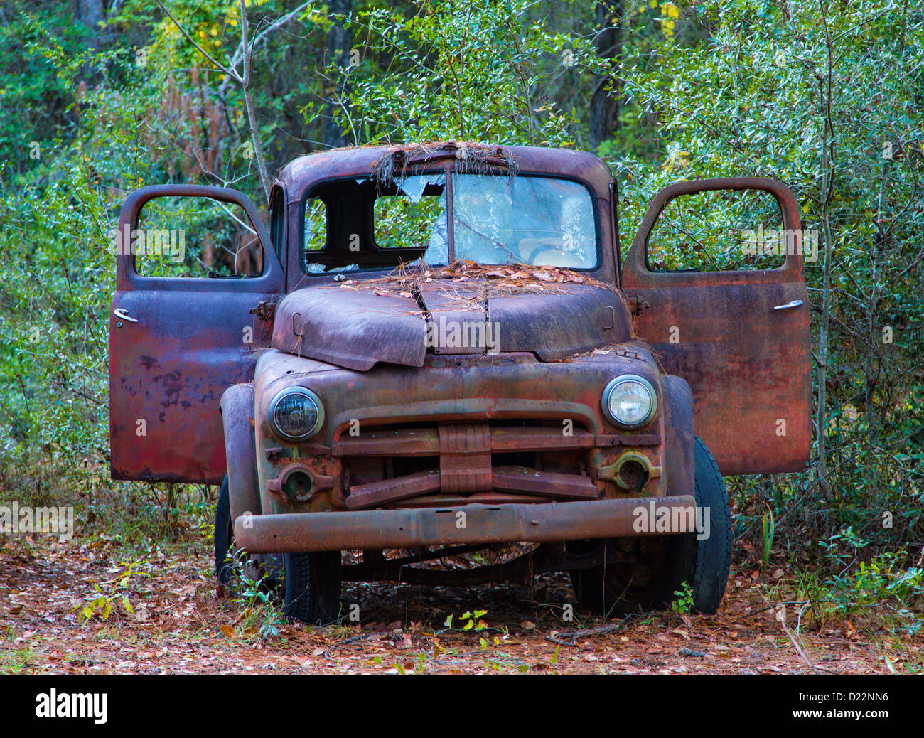 Old rusty broken down junk trucks Stock Photo