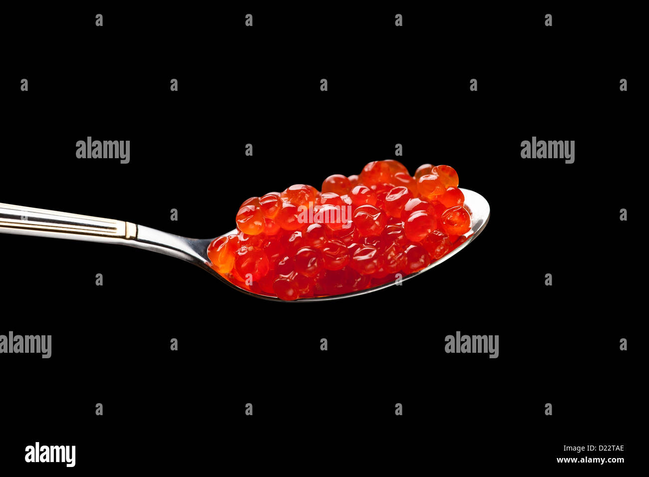 caviar red spoon against black background Stock Photo