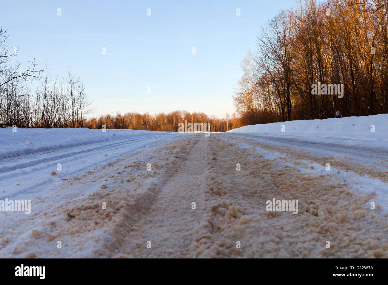 empty snowy country road in winter afternoon Stock Photo - Alamy