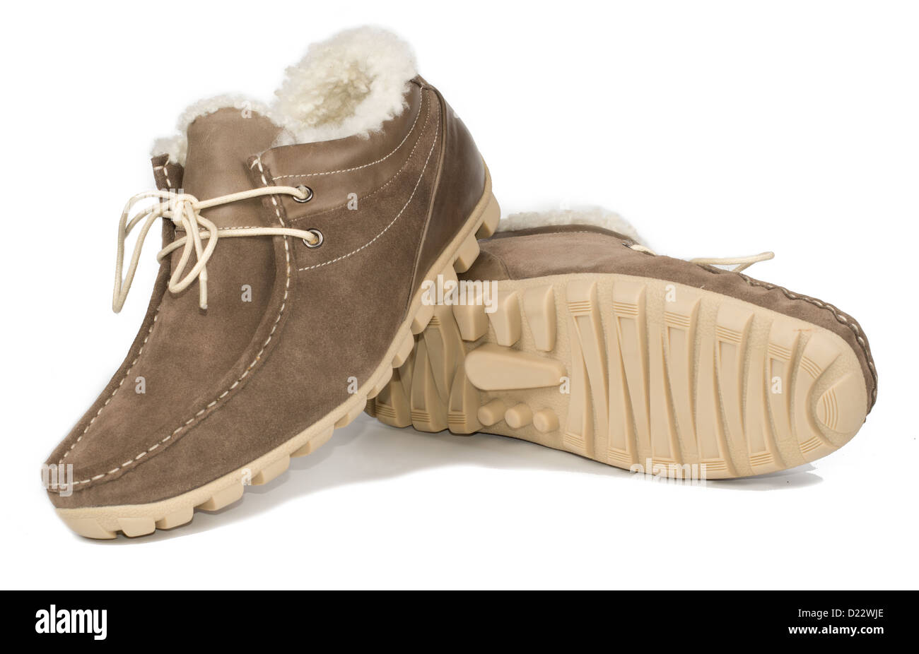 Casual brown fur-lined mens leather shoe with a flat sole and laces for everyday comfort wear in cold weather on a white studio Stock Photo