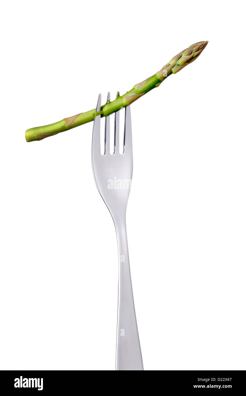 fresh asparagus on fork isolated over white background Stock Photo