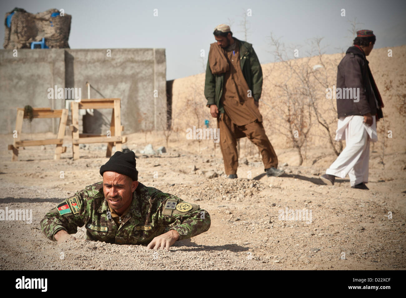 An Afghan National Army Soldier demonstrates counter improvised explosive device tactics during training in Farah province, Afghanistan, Jan.10, 2013. Afghan National Security Forces have been taking the lead in security operations, with coalition forces Stock Photo