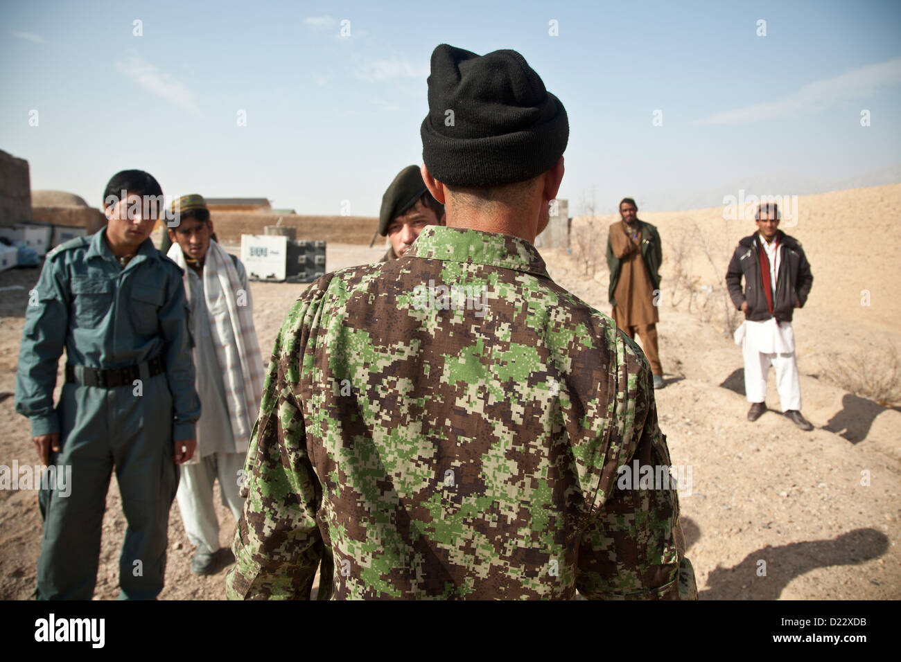An Afghan National Army Soldier talks about counter improvised explosive device tactics with fellow Afghan National Security Force members during training in Farah province, Afghanistan, Jan.10, 2013. Afghan National Security Forces have been taking the l Stock Photo